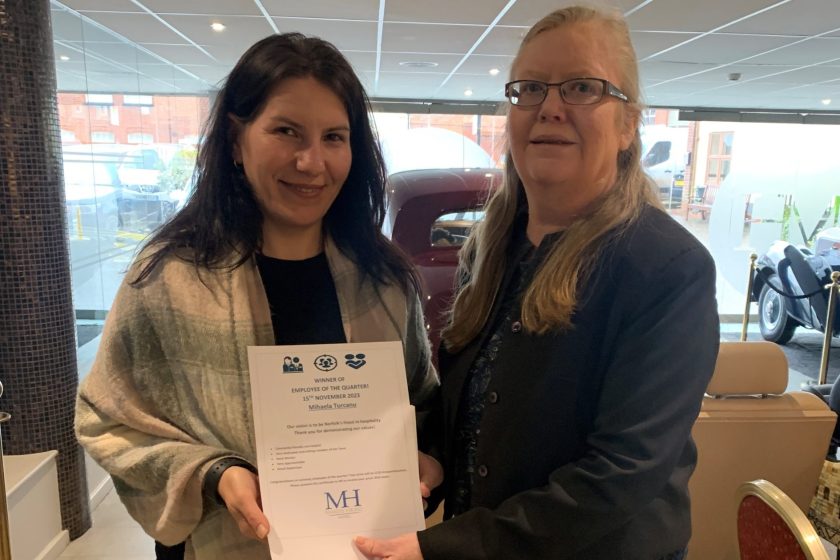 Mihaela with her V&V Employer of the Year Award